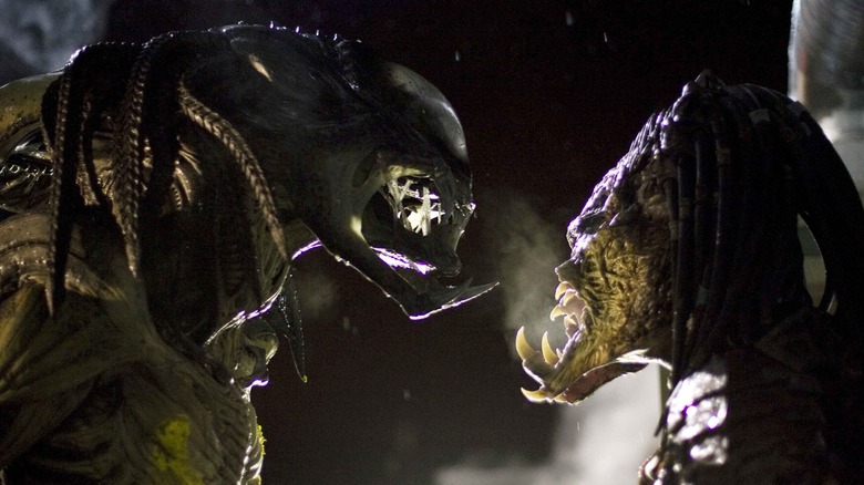 A Xenomorph/Predator facing off with a Predator