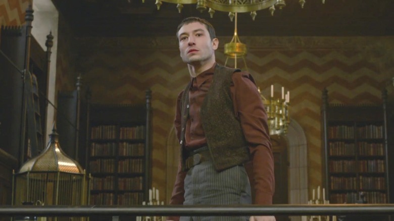 Credence Barebone standing in library