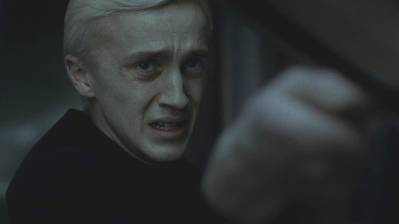 Crying Draco Malfoy pointing wand