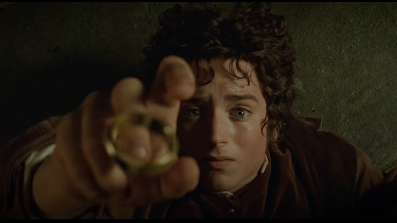 Frodo reaches for the ring