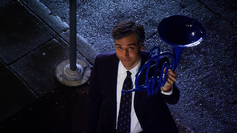 Ted holding blue French horn