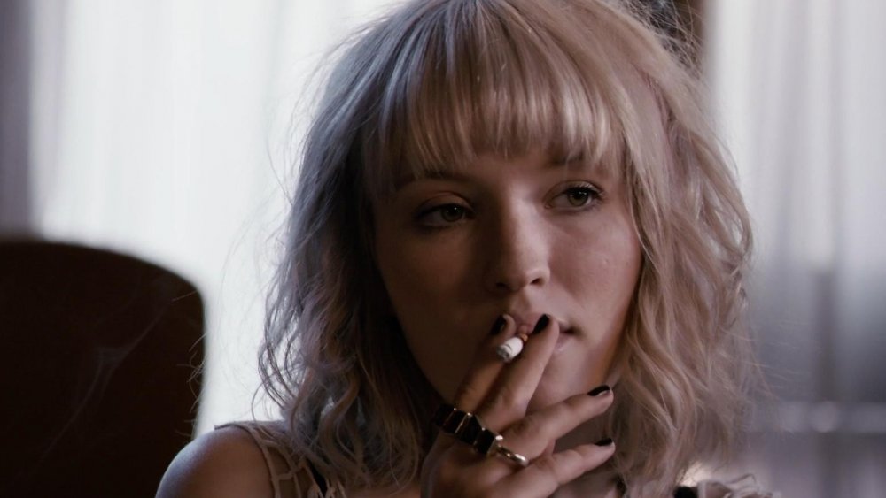 Emily Browning smokes a cigarette in Plush