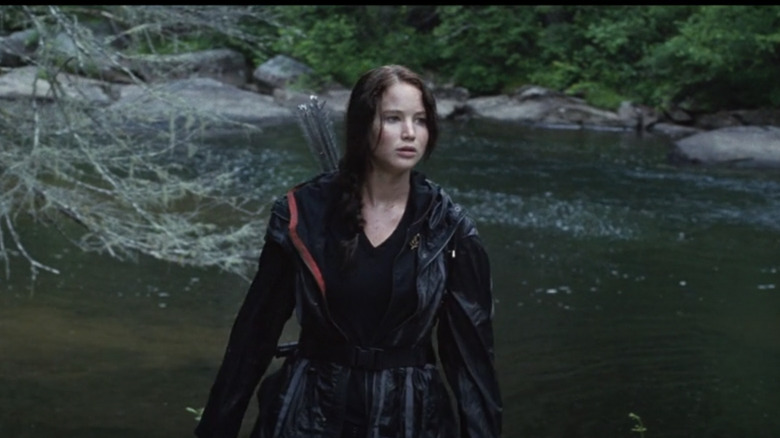 Jennifer lawrence as katniss walking along river