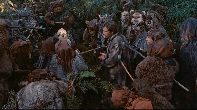 Han Solo talking to a tribe of Ewoks