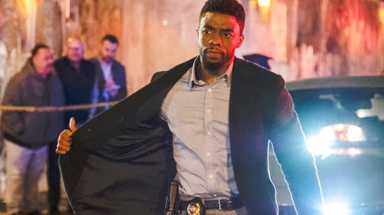 Chadwick Boseman flashes badge in 21 Bridges