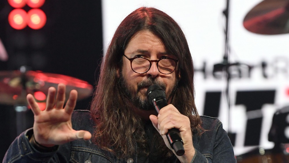 David Grohl talking into a microphone on stage