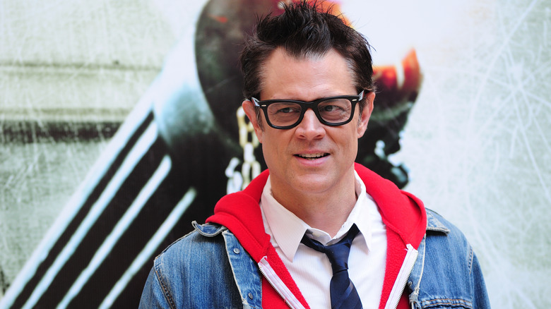 Johnny Knoxville wearing a shirt and tie