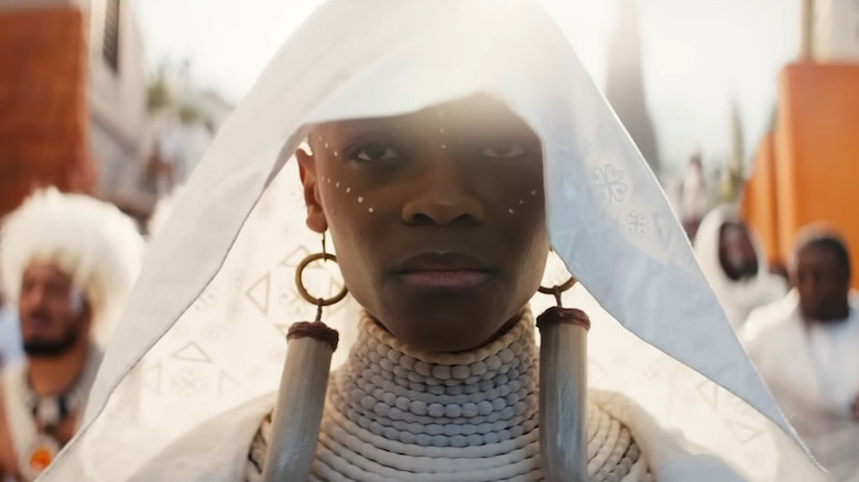 Shuri in a white veil in the street