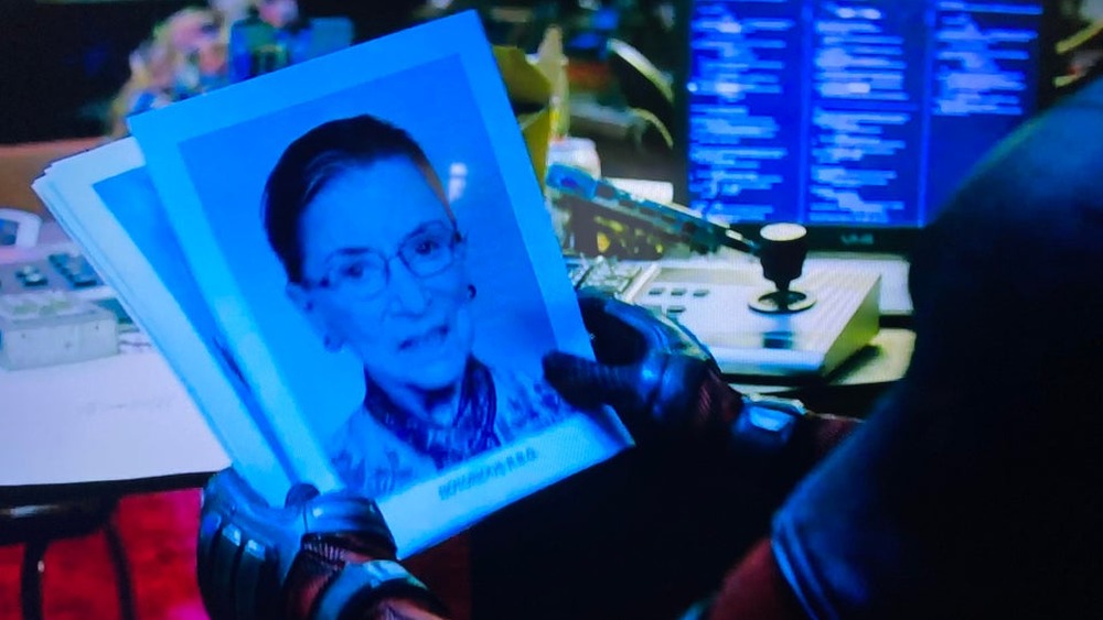 Deadpool holding a Ruth Bader Ginsburg picture