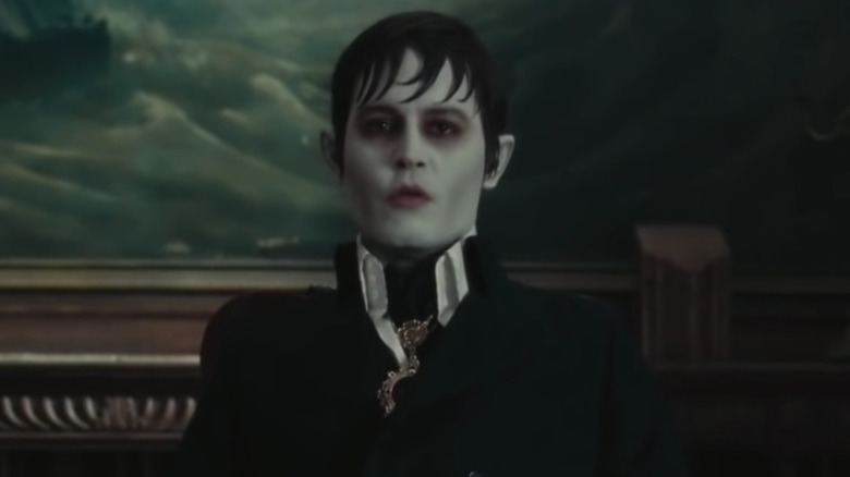 Johnny depp in dark shadows at dinner table 