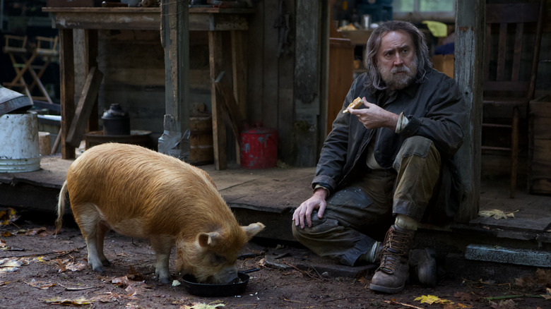 Nicolas Cage as Rob with his pig