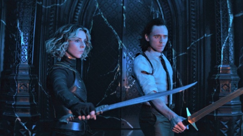 Loki and Sylvie holding swords