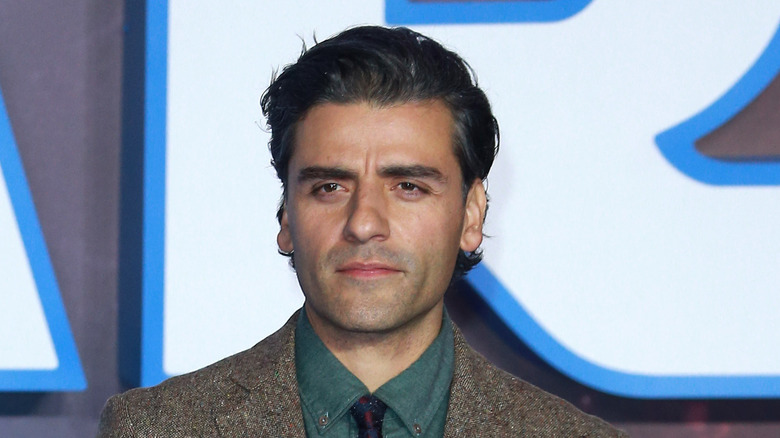 Oscar Isaac in suit and tie