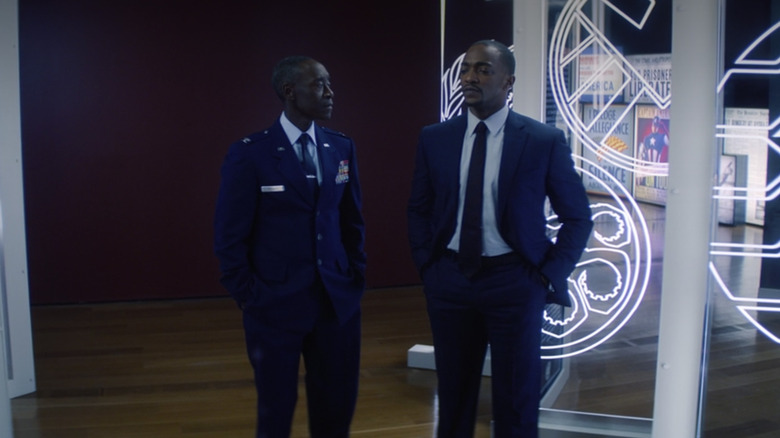 Sam and Rhodey talking in Captain America exhibit