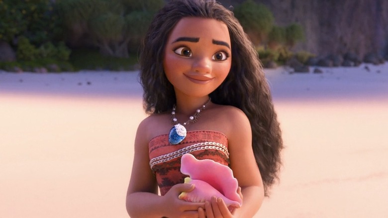 Moana holding a conch shell