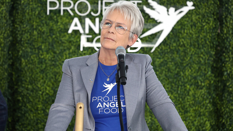 Jamie Lee Curtis standing at a podium