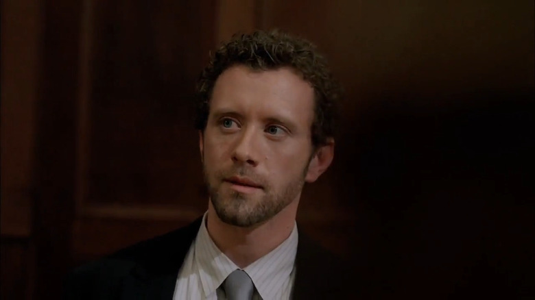 Hodgins giving a speech