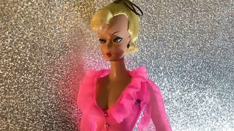 A Bild-Lilli doll wears a pink blouse