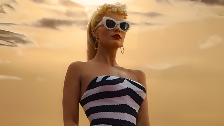 Barbie stands on sand dune