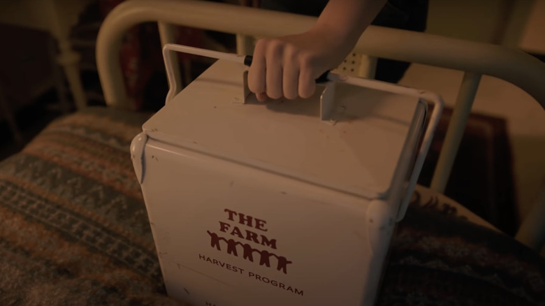 Betty holding The Farm organ bucket