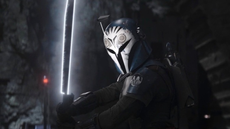 Bo-Katan holding the Darksaber