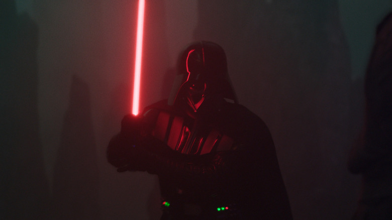 Darth Vader wielding lightsaber