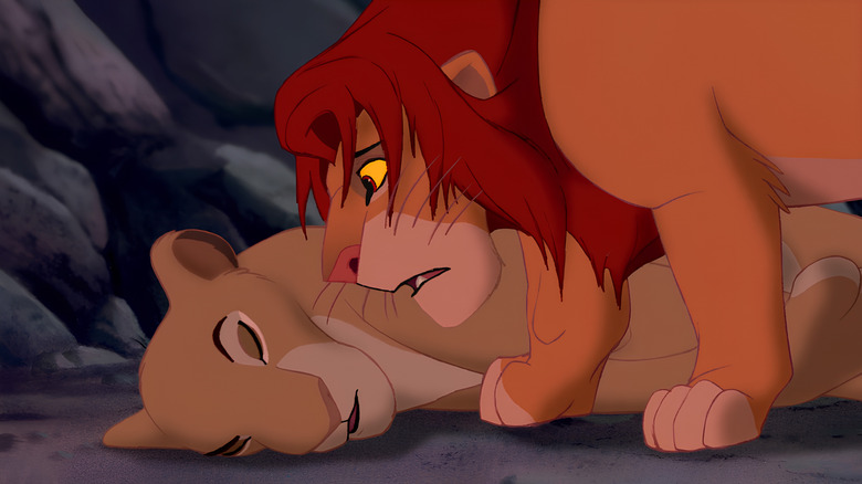 Simba looks down at Nala