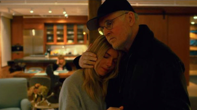 Charles Grodin hugging Sienna Miller