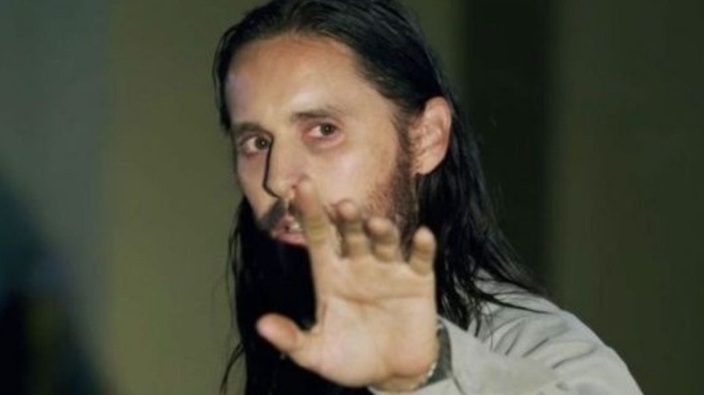 Jared Leto holding up hand