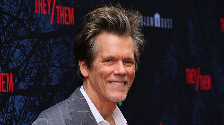 Kevin Bacon smiling pinstripe suit