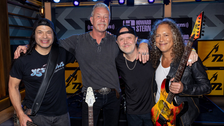 Metallica posing at Howard Stern show