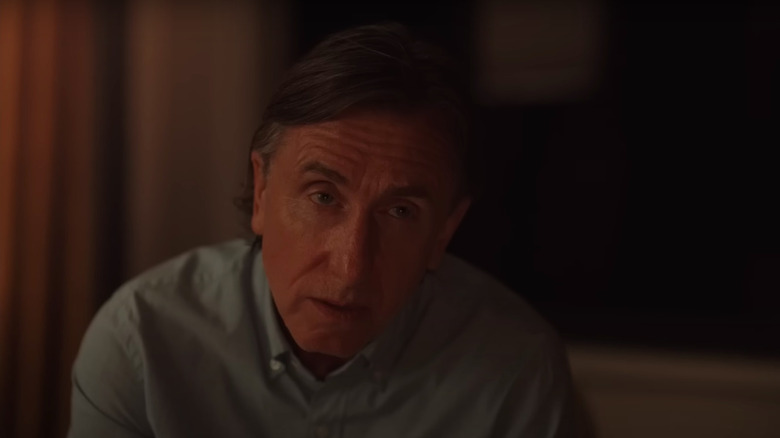 Tim Roth as David looking solemn