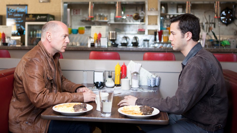 Bruce Willis as Old Joe and Joseph Gordon-Levitt as Young Joe in Looper