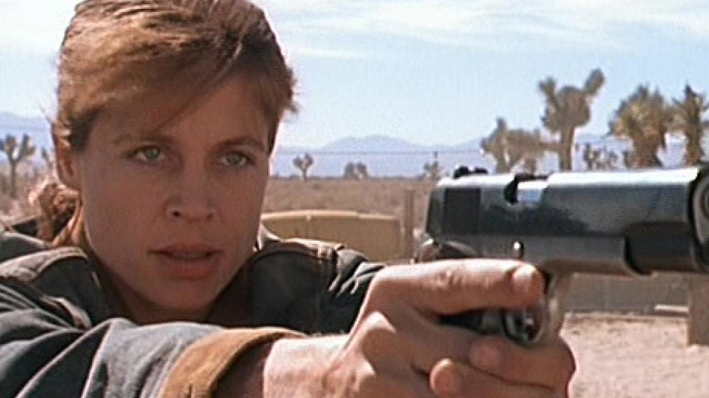 Sarah Connor aiming a pistol 