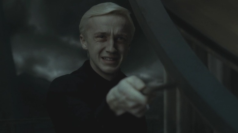 Draco crying and holding wand