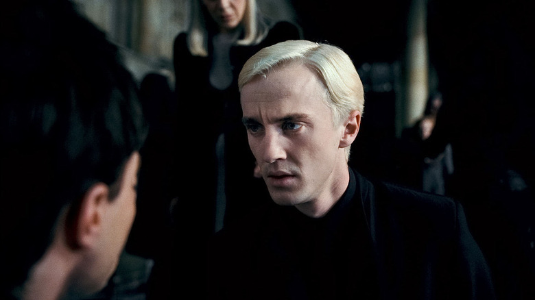 Draco looks at Harry