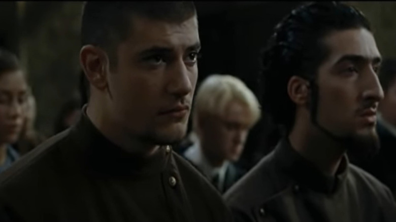 Viktor Krum looking ahead, Draco in background