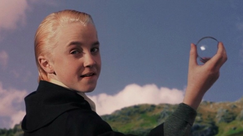 Draco holding the remembrall