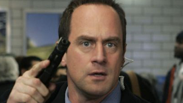 Stabler holds a gun