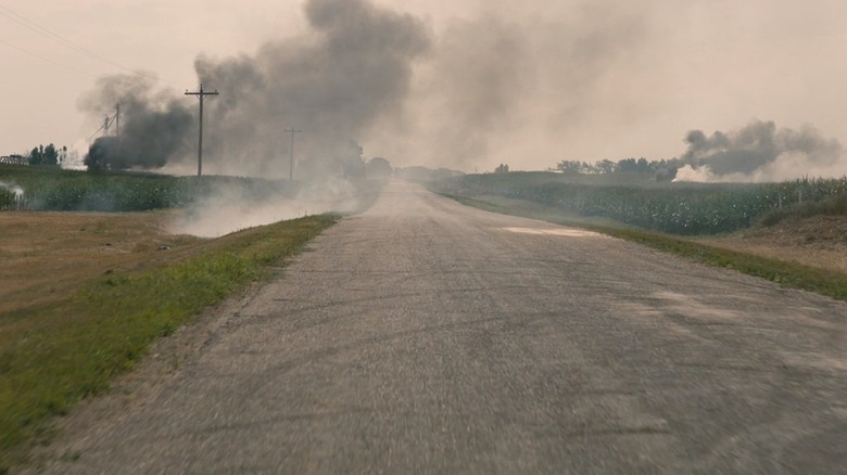 Smoke billowing through crop fields