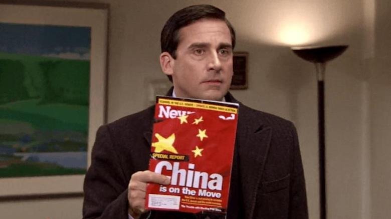 Michael holding a China magazine