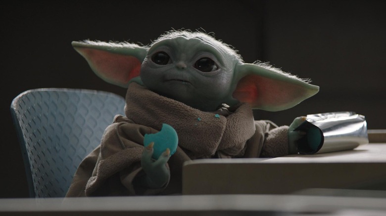 Grogu munching on a small snack Star Wars