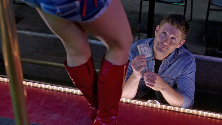 Dean giving stripper money