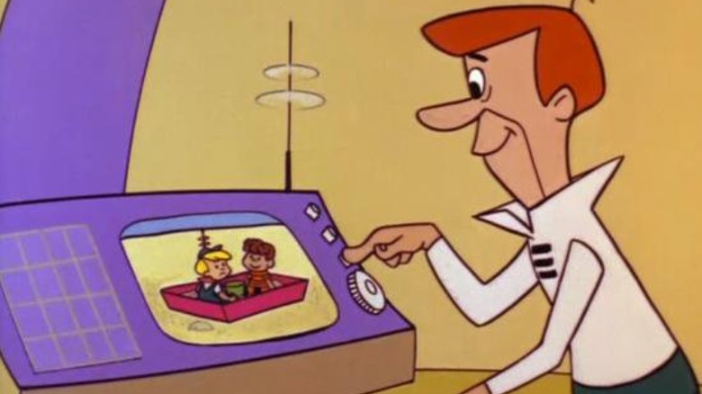 George Jetson pushes button and looks at computer screen