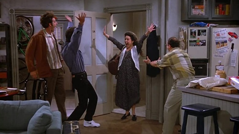 Kramer, Jerry, Elaine, and George celebrate