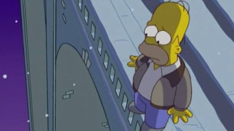 Homer standing on a bridge