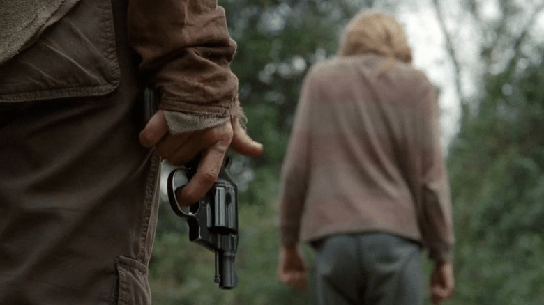 The gun in Carol's hand