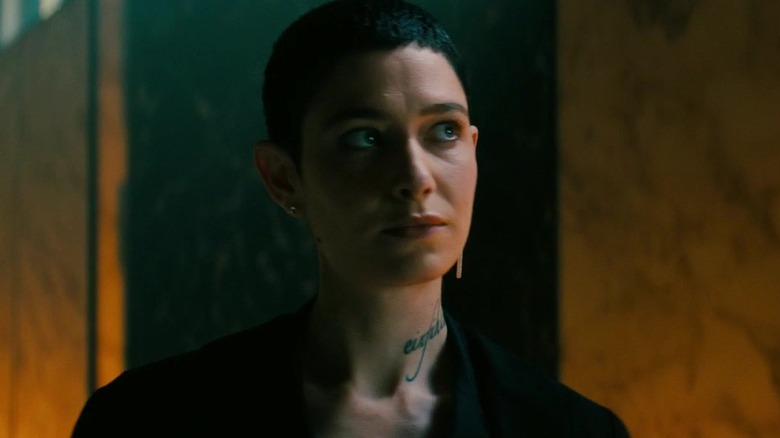 Asia Kate Dillon with tattoo and earring