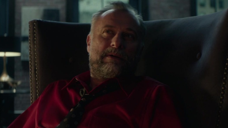 Michael Nyqvist in big chair