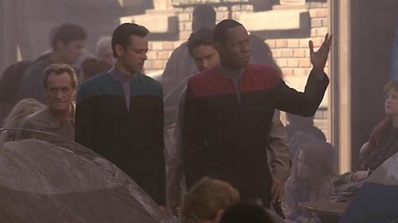 Sisko and Bashir walk through the sanctuary district